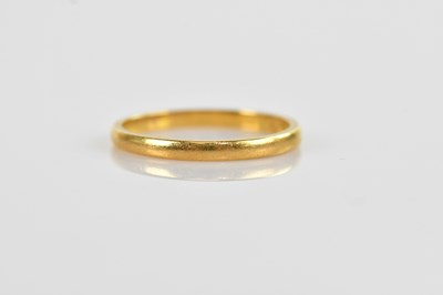 Lot 531 - A 22ct yellow gold wedding band, size R,...