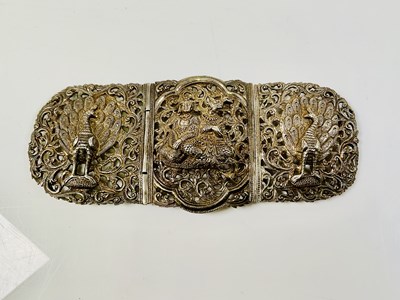 Lot 517 - A large Eastern white metal buckle, decorated...