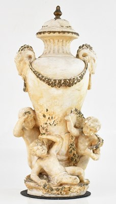 Lot 314 - A French plaster urn decorated with rams'...