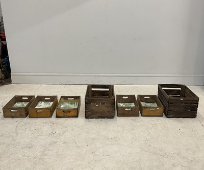 Lot 322 - A collection of seven wooden carrying crates,...