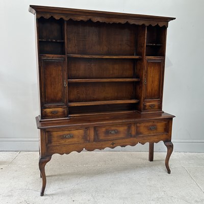 Lot 49 - An 18th century style oak dresser with boarded...