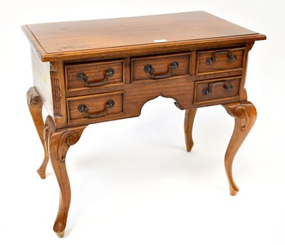 Lot 11 - A reproduction oak lowboy, with three over two...