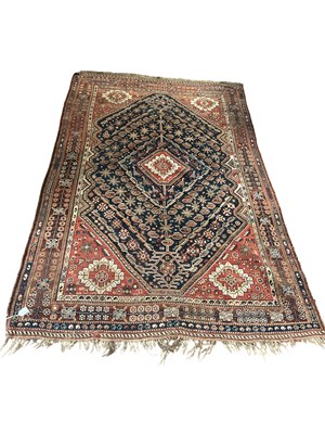 Lot 243 - A orange ground, hand knotted Caucasian rug,...