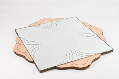 Lot 41 - An Art Deco peach glass wall mirror, 64 x 64cm.