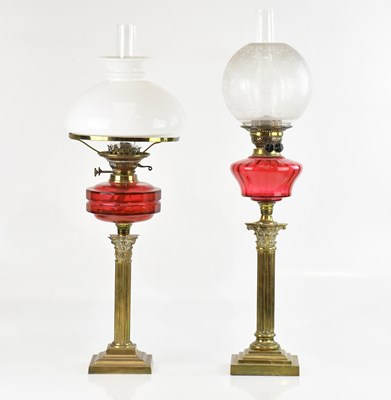 Lot 635 - Two Victorian oil lamps each with cranberry...