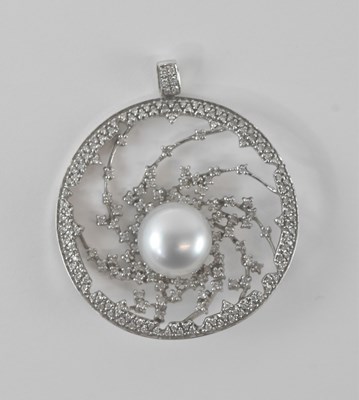 Lot 526 - A white metal pierced openwork circular...