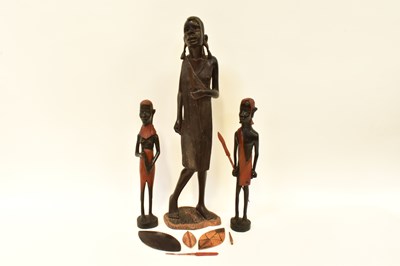 Lot 204 - Three African carved Maasai warriors with...
