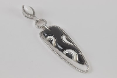 Lot 525 - An 18ct white gold diamond, onyx and white...