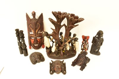 Lot 206 - A collection of African carved wooden items,...
