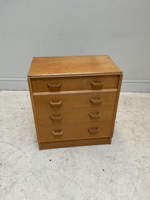 Lot 13 - G PLAN; a Brandon mid century oak four drawer...