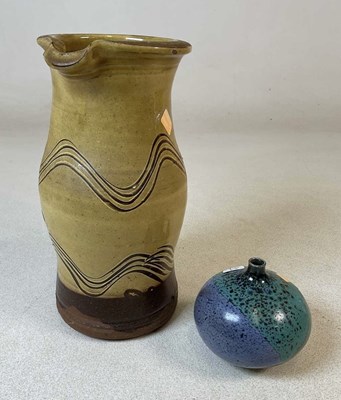 Lot 367 - CLIVE BOWEN; a tall studio pottery jug, with...