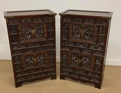 Lot 104 - A pair of Chinese cabinets with intricate...