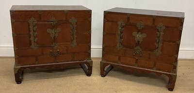 Lot 54 - A pair of Chinese wooden and brass low...