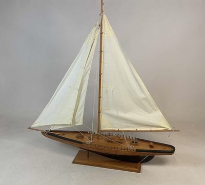 Lot 157 - A large wooden model of a yacht, length 105cm.