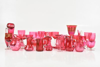 Lot 1792 - A collection of cranberry glass including jugs,...