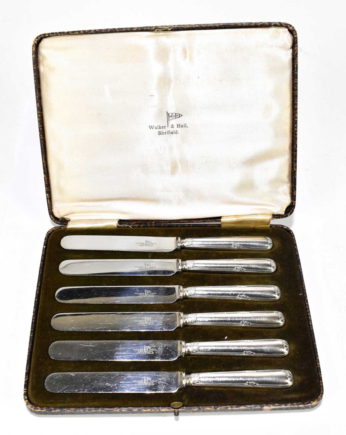 Lot 1199 - WALKER & HALL; a cased set of six silver plate and steel bladed tea knives