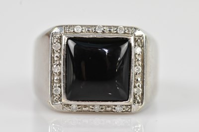 Lot 2517 - A 9ct white gold diamond and onyx set signet...