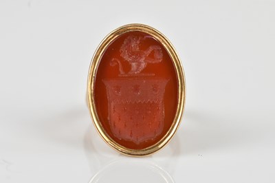Lot 2435 - A yellow metal signet ring stamped '9c',...