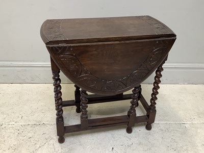 Lot 85 - A reproduction oak drop-leaf table, height...