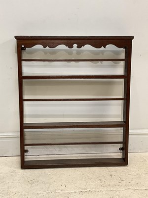 Lot 189 - A 19th century oak plate rack with carved...