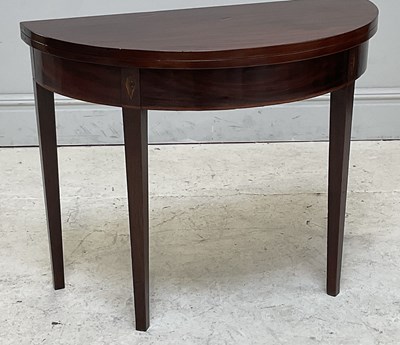 Lot 182 - A Georgian mahogany fold-over tea table, width...