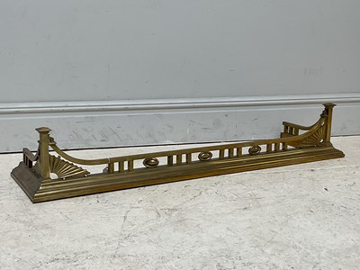 Lot 438 - A late Victorian brass fender/fire kerb,...