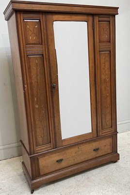 Lot 119 - An Aesthetic Movement carved oak wardrobe,...