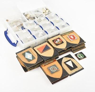 Lot 1260 - A collection of military cap badges and...