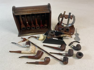 Lot 128 - A large collection of pipes, also an oak...