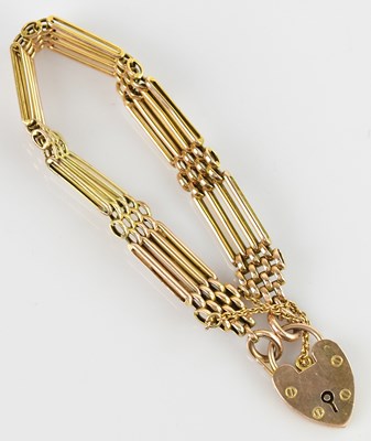 Lot 538 - A yellow metal gate link bracelet with padlock...