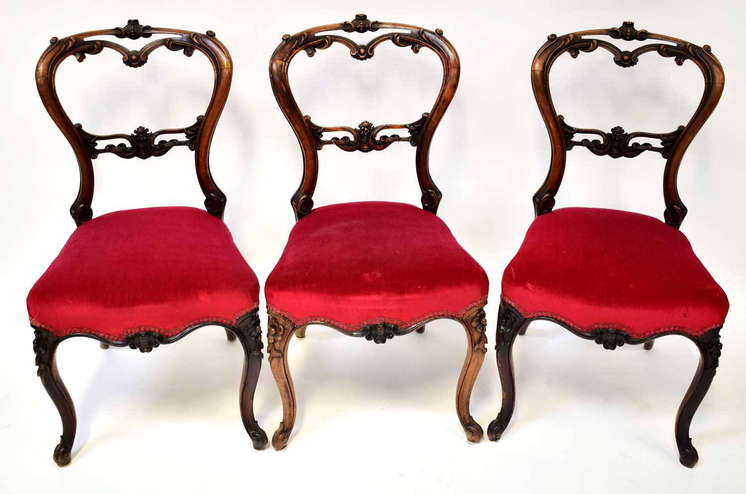 Lot 43 - A set of six Victorian carved mahogany balloon-...