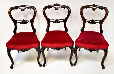 Lot 43 - A set of six Victorian carved mahogany balloon-...