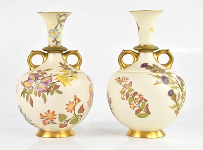 Lot 1207 - ROYAL WORCESTER; a near pair of twin handled...