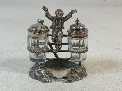 Lot 453 - A Victorian silver plated cruet frame modelled...
