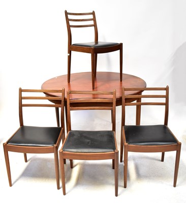 Lot 7 - G-PLAN; a teak circular extending dining table...