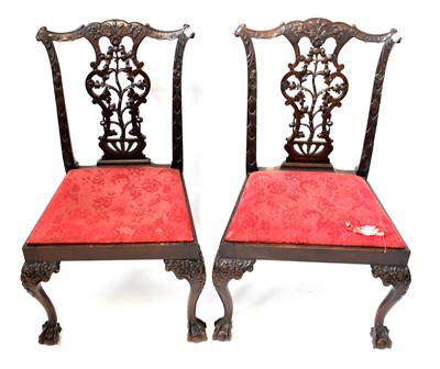 Lot 24 - A set of four ornately carved...