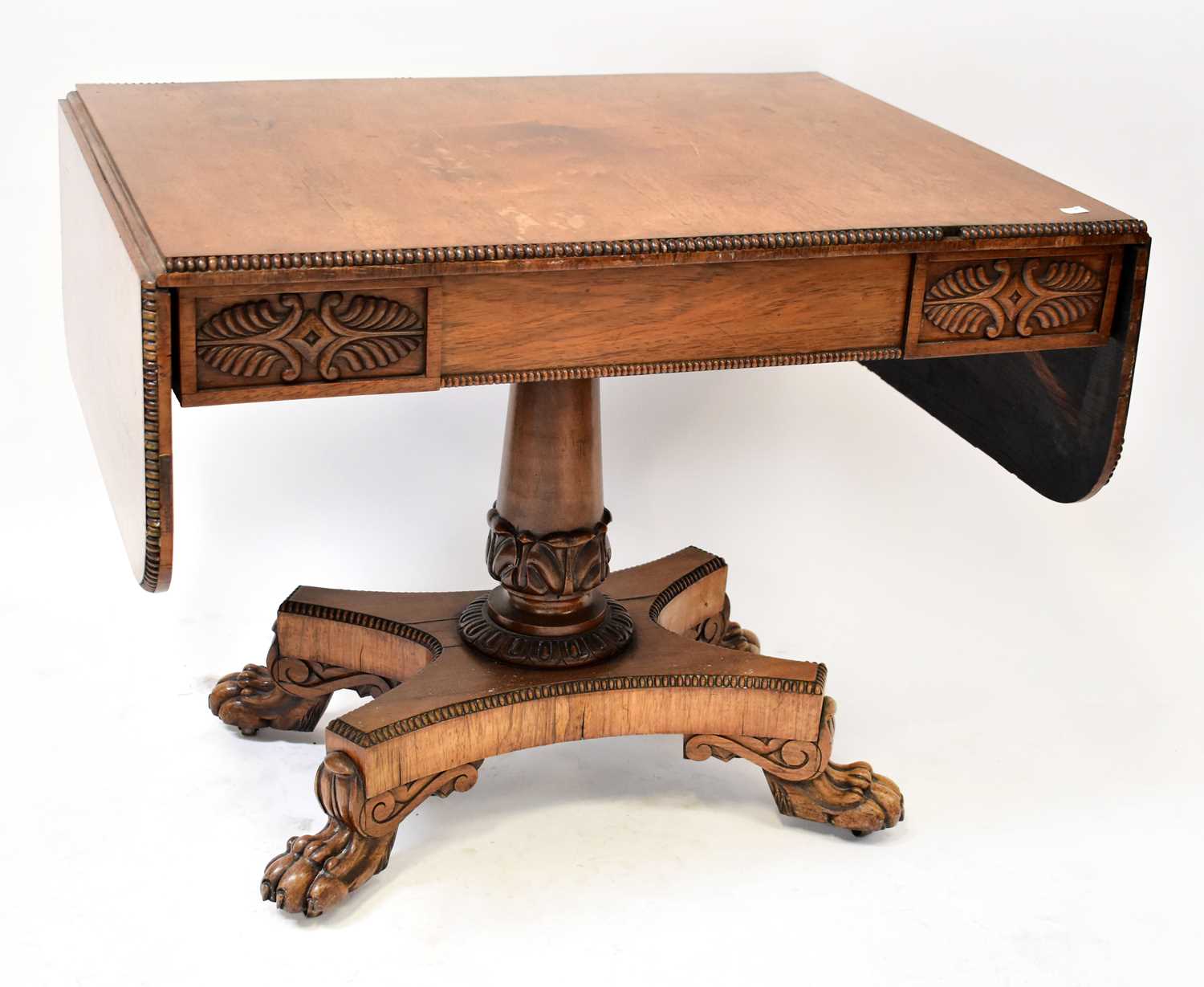 Lot 26 - A Regency rosewood sofa table, with gadrooned...