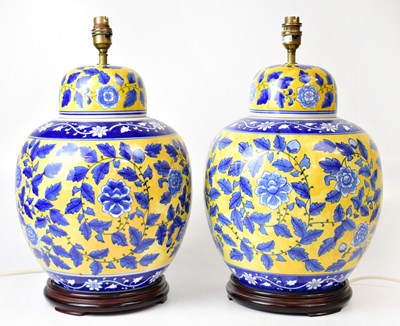 Lot 69 - A pair of yellow ground ginger jars with blue...