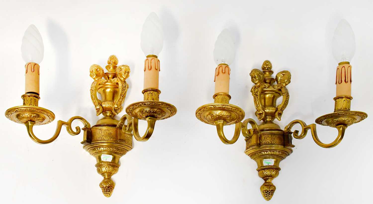 Lot 71 - A set of four gilt brass wall sconces, each...