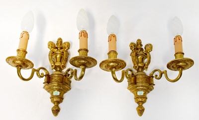 Lot 71 - A set of four gilt brass wall sconces, each...