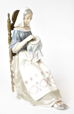 Lot 103 - LLADRÓ; a porcelain figure, 'The Embroiderer',...