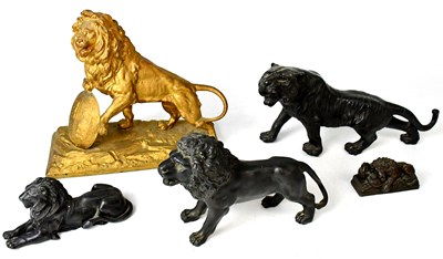Lot 197 - A gold painted cast metal figure of a lion...