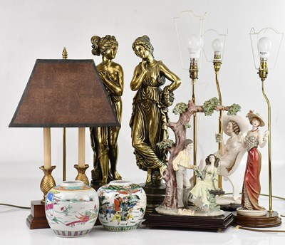 Lot 621 - A collection of four decorative lamps, largest...