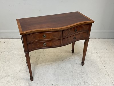 Lot 209 - A reproduction mahogany four drawer hall table...