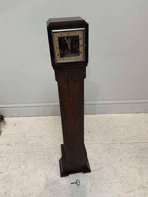 Lot 259 - A 1920s oak cased grandmother clock, with gilt...