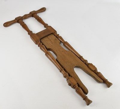 Lot 347 - PEAL & CO; a late 19th century oak boot jack,...