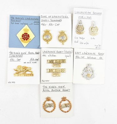 Lot 1278 - A collection of cap badges comprising The King'...