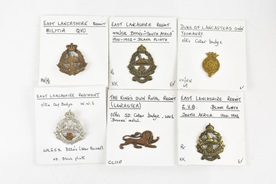 Lot 1272 - A collection of cap and collar badges...