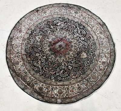 Lot 242 - A silk Caucasian circular grey ground rug,...
