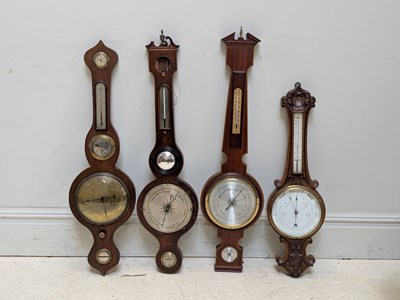 Lot 396 - A late Victorian carved oak aneroid barometer,...